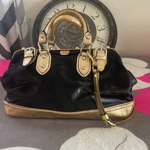 Maxx New York gold and black purse